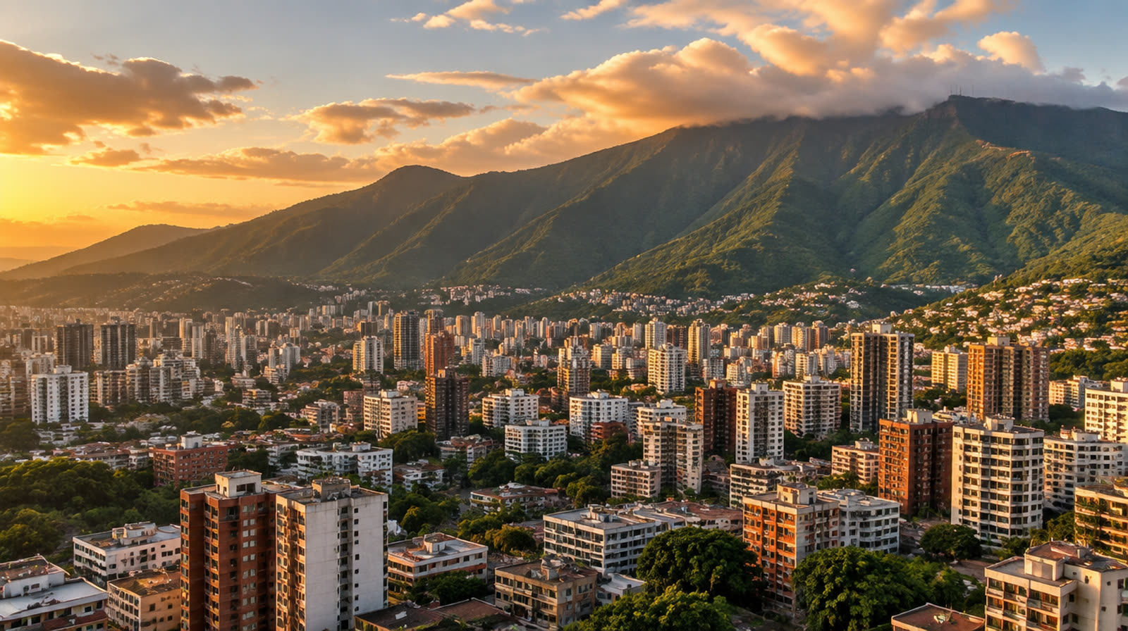 Apartment buildings of Caracas in the valley below the Ávila mountain range at sunset